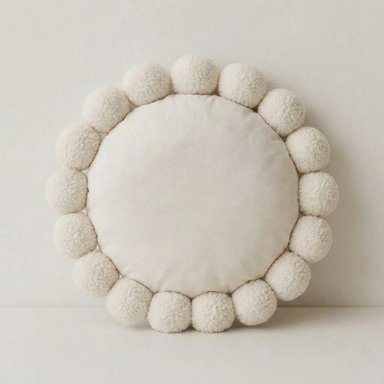 COJIN REDONDO CON POMPONES COLOR PERLA 38 CM