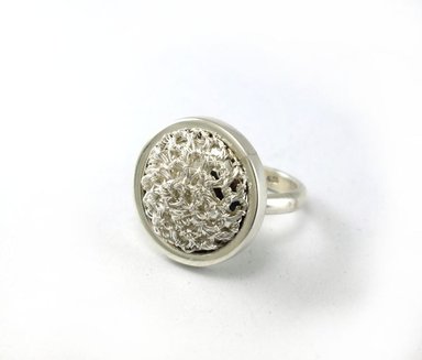 ANILLO RELISE TEJIDO REDONDO PLATA