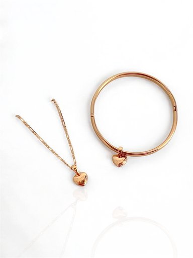 COLLAR CON CORAZÓN Y PUÑERA CON CORAZÓN - NAIF JEWELRY - ENCHAPADO EN ORO 18 K (ORO ROSA)